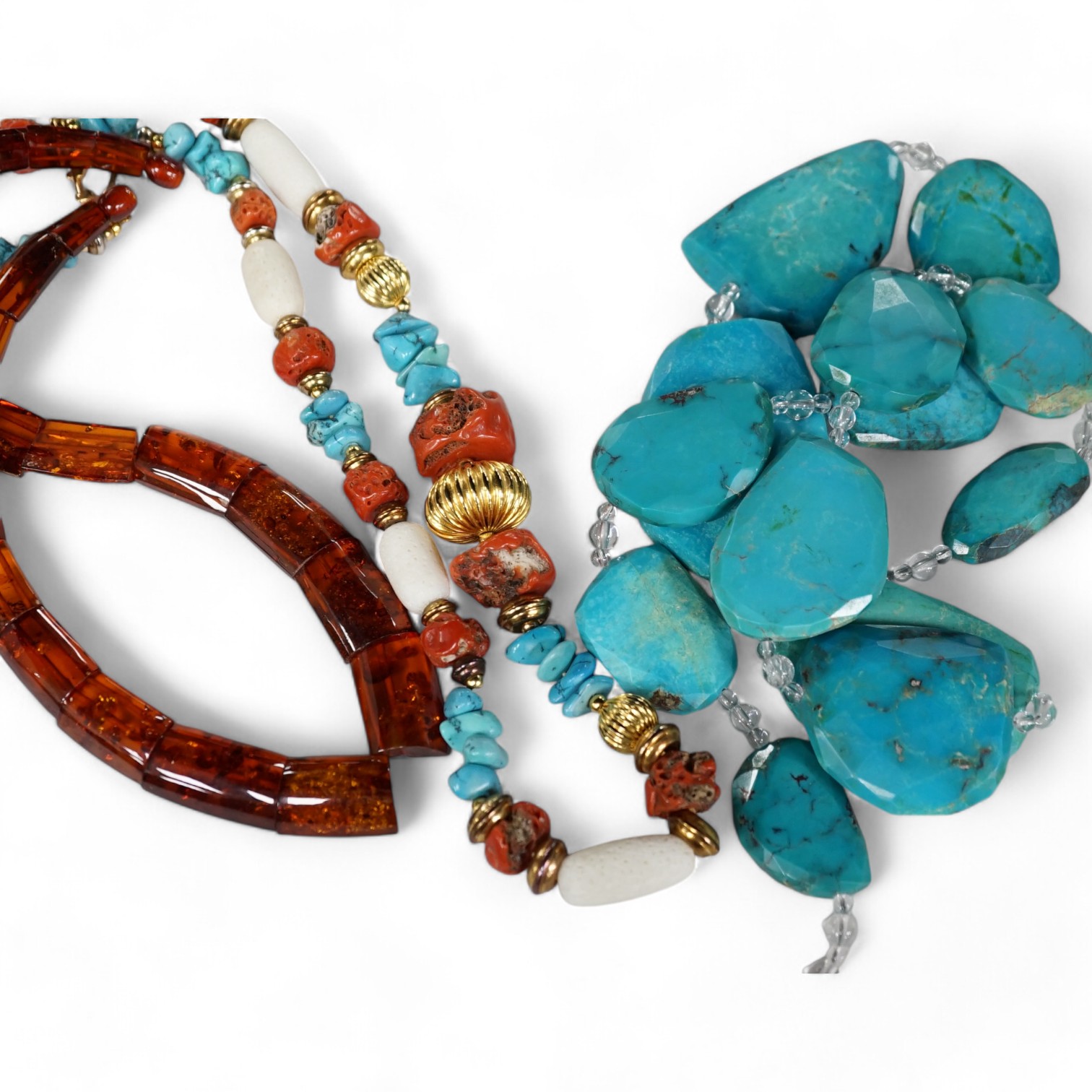 A turquoise pebble set necklace with rock crystal bead spacers, with 925 clasp, 78cm, an amber necklace and a turquoise and coral set necklace. Condition - fair